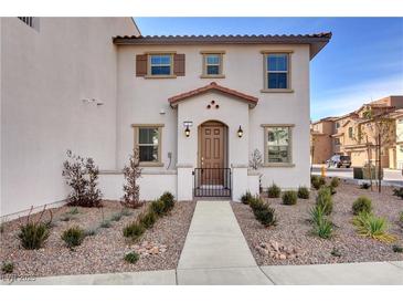 Charming two-story home with desert landscaping, covered entry, and warm exterior paint tones at 4 Lomita Heights Dr, Las Vegas, NV 89138