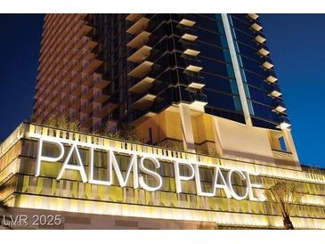 Exterior shot of the Palms Place building at night showcasing its modern design and illuminated signage at 4381 Flamingo Rd # 2612, Las Vegas, NV 89103