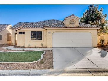 Charming single-story home featuring a tile roof, desert landscaping, and an attached two-car garage at 6143 Basilone Ave, Las Vegas, NV 89122