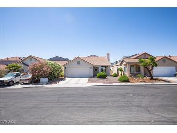 Charming single-story home with a well-maintained front yard and a two-car garage at 8437 Cinnamon Hill Ave, Las Vegas, NV 89129