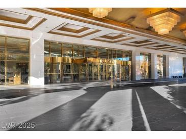 A stunning entrance featuring revolving doors and decorative ceilings with unique lighting fixtures at 2000 N Fashion Show Dr # 5326, Las Vegas, NV 89109