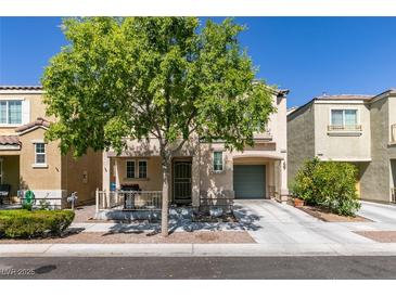 Charming two-story home with a well-maintained front yard and a covered porch at 7645 Interlace St, Las Vegas, NV 89149