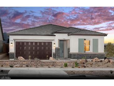 Charming single-story home with a two-car garage, neutral paint scheme, and a well-manicured front yard at 121 Piano Ln # Lot 198, Henderson, NV 89015