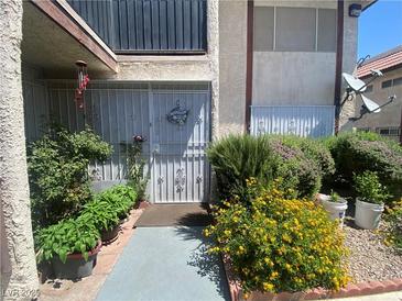 Charming condo with a quaint front entrance, beautiful flowers and a secure gated entry at 1748 Jupiter Ct # C, Las Vegas, NV 89119