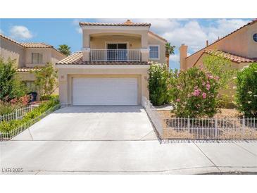 Charming two-story home with a well-manicured front yard, balcony and a two-car garage, enhancing its curb appeal at 2452 Silver Shadow Dr, Las Vegas, NV 89108
