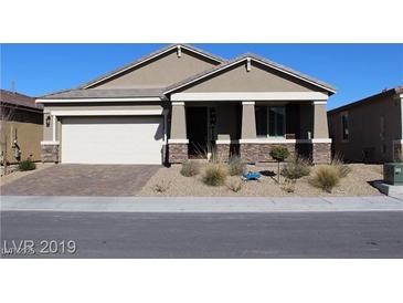Charming single-story home with a low-maintenance desert-style landscaped front yard and attached two-car garage at 4108 Fairywren Dr, North Las Vegas, NV 89031