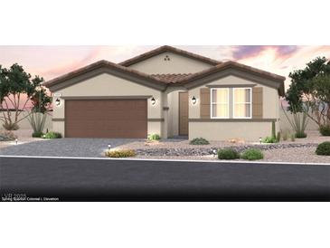 Charming single-story home featuring a desert landscape, tiled roof, and a two-car garage at 4709 Woodland Ave # Lot 22, Las Vegas, NV 89121