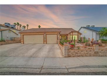 Charming single-story home featuring desert landscaping, a three-car garage, and well-maintained architecture at 6508 Peppermill Dr, Las Vegas, NV 89146