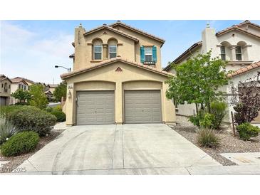 Charming two-story home featuring a two-car garage, desert landscaping, and a tile roof at 7815 Shingle Beach St, Las Vegas, NV 89166