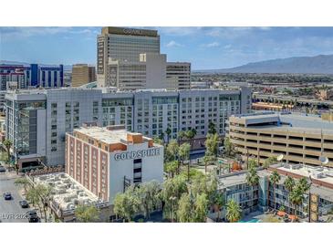 Bright city view of buildings, hotels, and cityscape with blue sky and scenic mountain range in the background at 150 Las Vegas Blvd # 1503, Las Vegas, NV 89101