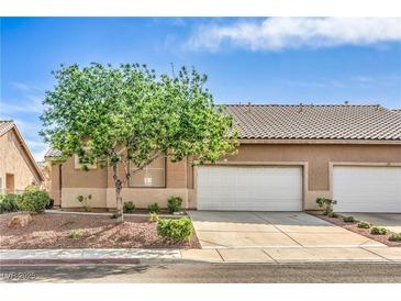 Charming single-story home with a well-manicured front yard, and a large two car garage at 202 Twin Creek St, Henderson, NV 89074