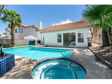 Inviting backyard features a sparkling pool and spa, perfect for outdoor entertaining at 8640 Trafalgar Dr, Las Vegas, NV 89117