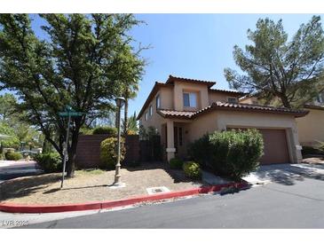 Charming two-story home with a tile roof and an attached garage in a well-maintained neighborhood at 1220 Padre Serra Ln, Las Vegas, NV 89134