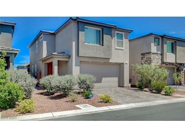 Modern two-story home featuring a two-car garage, desert landscaping, and a neutral color palette at 4160 Elegant Chateau St, Las Vegas, NV 89135