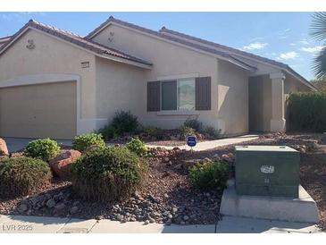 Charming single-story home with low-maintenance landscaping and a two-car garage at 6412 Starling Mesa St, North Las Vegas, NV 89086