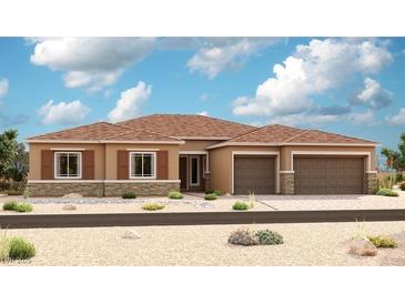 Charming single-story home boasts a two-car garage, desert landscaping, and a stylish exterior at 9870 Amati Ave, Las Vegas, NV 89149