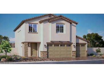 Charming two-story home featuring a two-car garage and neutral-toned stucco exterior, complemented by tasteful stone accents at 1206 Dre Harbor Pl. Ln # 84, North Las Vegas, NV 89084