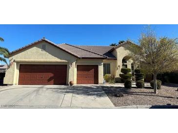 Charming single-story home with a two-car garage and manicured landscaping, ideal for comfortable living at 5016 Wayfaring Tree Ave, Las Vegas, NV 89131