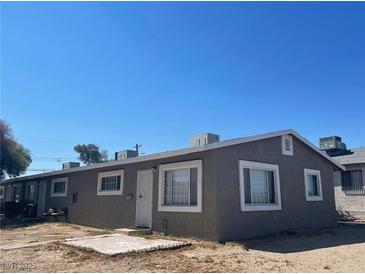 Charming single-story home with a low-pitched roof and a simple, minimalist design, providing an affordable starter home at 1834 E Bonanza Rd, Las Vegas, NV 89101