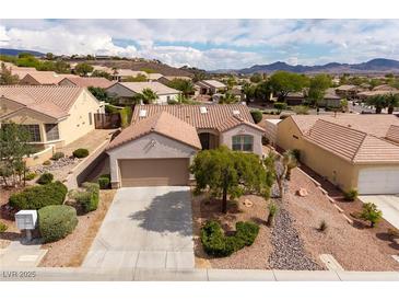 Charming single-story home featuring desert landscaping, a two-car garage, and tile roofing at 3071 Lake Barkley Rd, Henderson, NV 89052