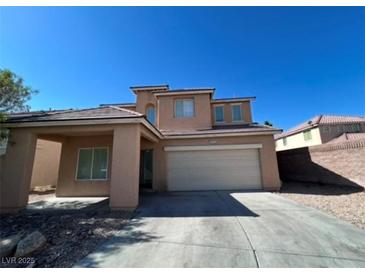 Charming two-story home featuring a two-car garage and low maintenance desert landscaping at 3615 Dutchmans Vine Ct, North Las Vegas, NV 89081