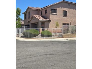 Charming two-story home with a well-maintained front yard and a secure white metal fence at 3954 Crystal Trip Ct, Las Vegas, NV 89129