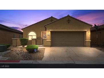 Charming single-story home with a well-manicured front yard and a two-car garage in a residential neighborhood at 4062 Vulcan St, Las Vegas, NV 89122