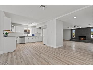 Bright open-concept living room flows to the kitchen with updated appliances and sleek countertops at 6229 Cromwell Ave, Las Vegas, NV 89107