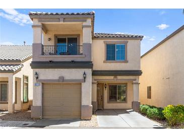 Charming two-story home featuring a balcony, covered entry, and attached garage at 9613 Eland Ct, Las Vegas, NV 89149
