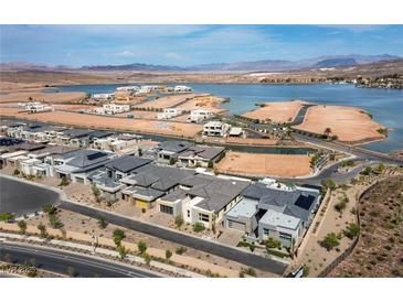 Gorgeous aerial view of a lakeside community featuring modern homes and scenic views at 104 Tre Pietre St, Henderson, NV 89011