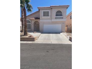 Charming two-story home with a spacious two-car garage and desert landscaping at 1551 Echo Falls Ave, Las Vegas, NV 89183