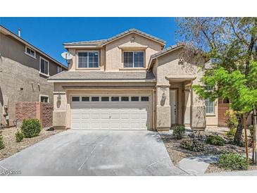 Charming two-story home with a well-maintained front yard and a two-car garage at 216 Sharp Edge Ave, North Las Vegas, NV 89031