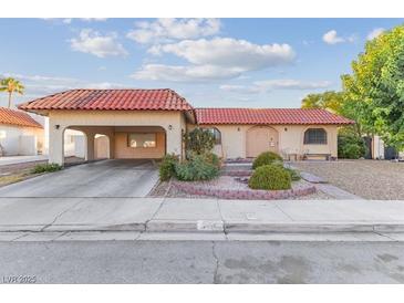 Charming single-story home featuring a terracotta tile roof and a cozy covered parking area at 3625 Barcelona St, Las Vegas, NV 89121