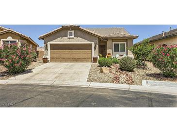 Charming single-story home featuring a well-maintained front yard with desert landscaping and an attached garage at 3642 Winter Whitetail St, Las Vegas, NV 89122
