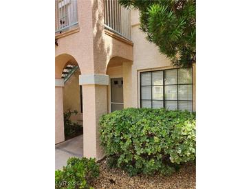 Charming condo featuring well-maintained landscaping near the entrance, enhancing its curb appeal at 4805 S Torrey Pines Dr # 101, Las Vegas, NV 89103