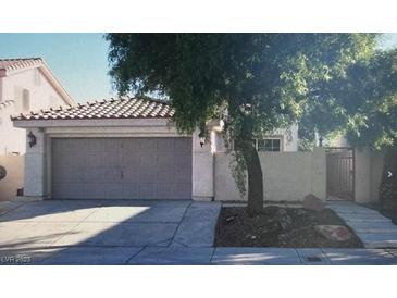 Charming single-Gathering home featuring a two-car garage and gated entrance at 7705 Sanction Ave, Las Vegas, NV 89131