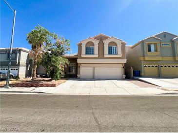 Charming two-story home featuring a neutral color scheme and a spacious two-car garage, ideal for families at 8125 Rio De Janeiro Dr, Las Vegas, NV 89128