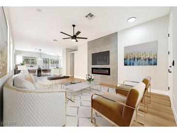 Inviting living room featuring a modern fireplace and stylish furnishings at 10017 Snow Crest Pl, Las Vegas, NV 89134
