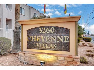 Community signage for 3260 Cheyenne Villas featuring stone accents and well-maintained landscaping at 3322 Dragon Fly St, North Las Vegas, NV 89032