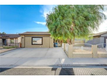 Charming single-story home featuring a spacious driveway and mature shade tree at 520 Prince Alan Ct, Las Vegas, NV 89110