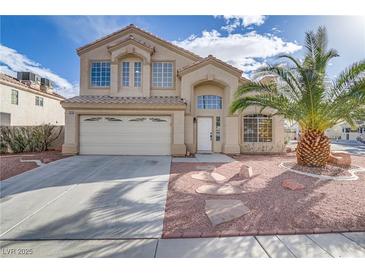 Charming two-story home with a well-manicured yard and a spacious two-car garage at 7973 Macklin St, Las Vegas, NV 89129