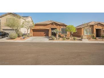 Charming single-story home with desert landscaping, a two-car garage and a warm, inviting curb appeal at 132 Soaring Sky Ave, Henderson, NV 89011