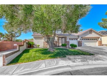 Charming single-story home features a well-manicured lawn and mature shade tree at 2544 Ashley Rose Ter, Henderson, NV 89052