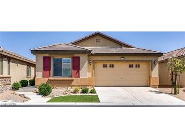 Charming single-story home with a well-manicured lawn and a two-car garage at 3720 Rocklin Peak Ave, North Las Vegas, NV 89081