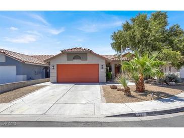 Charming single-story home with a desert-landscaped front yard and an attached two-car garage at 1225 Stonesthrow Cir, North Las Vegas, NV 89031