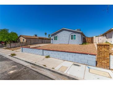 Charming single-story home with a well-maintained front yard and a classic exterior design at 2432 Spanish Ct, Las Vegas, NV 89108
