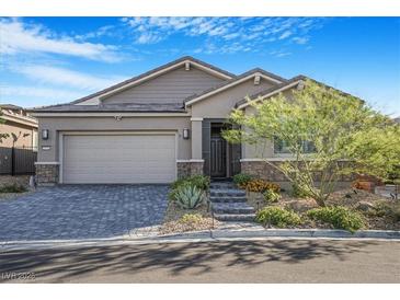 Charming single-story home with a manicured front yard and a two-car garage at 2771 Free Formed Ct, Las Vegas, NV 89138