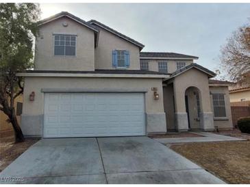 Charming two-story home with a spacious two-car garage and concrete driveway at 3021 New Journey Way, North Las Vegas, NV 89031