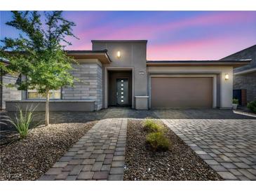 Charming single-story home with desert landscaping, stone accents, and a spacious two-car garage at 6684 Regency Stone Way, Las Vegas, NV 89148