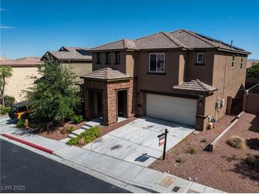 Charming two-story home with a two car garage, desert landscaping, and covered entry way at 10373 Northern Hills Ave, Las Vegas, NV 89166